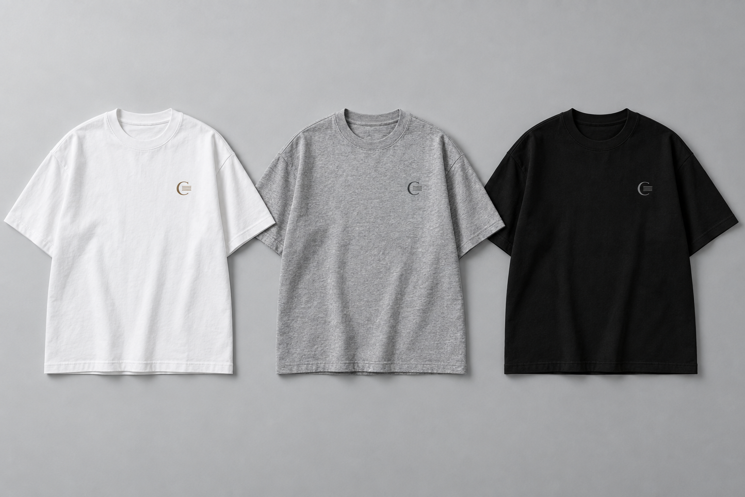 Three Cortex concept T-shirts: white with bronze detailing, heather grey with graphite detailing, and black with tonal detailing.